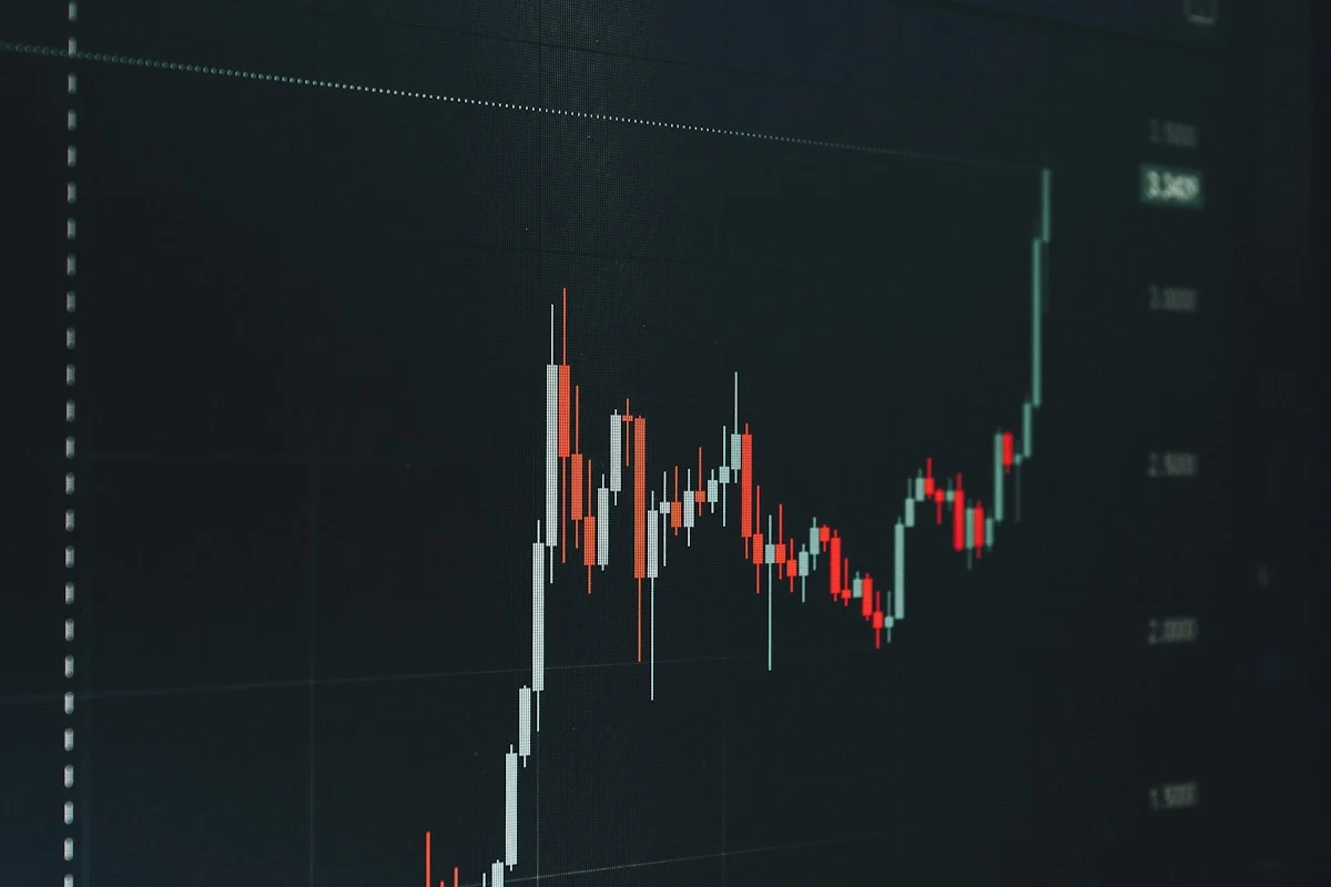 Financial analyst at trading desk representing finance industry link building by White Hat Works