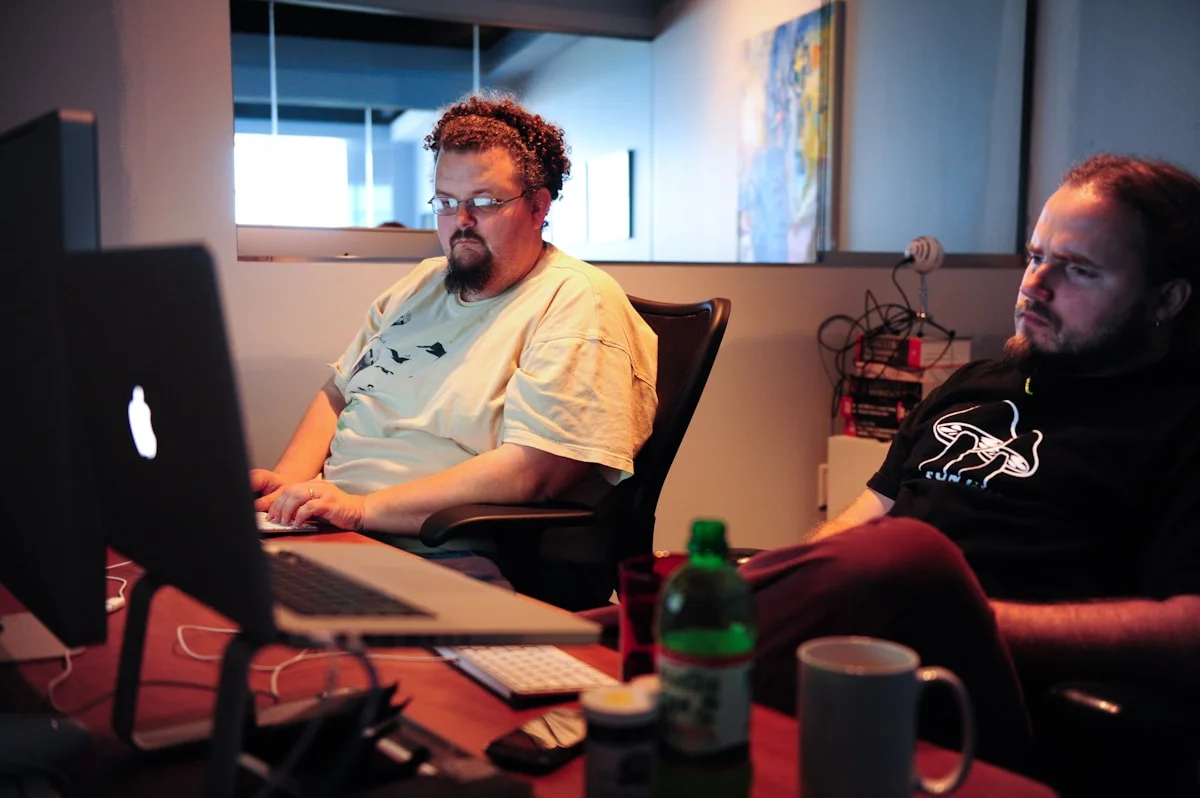 Software development team collaborating in office, representing SaaS link building by White Hat Works